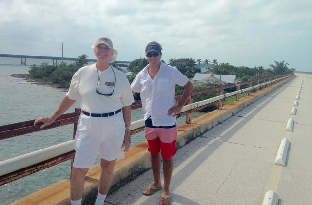 McKinnon and a visiting childhood friend on the the Old Seven Mile Bridge, set to reopen to pedestrians and visitors for recreational activities and trolley service to the island by March 2022.