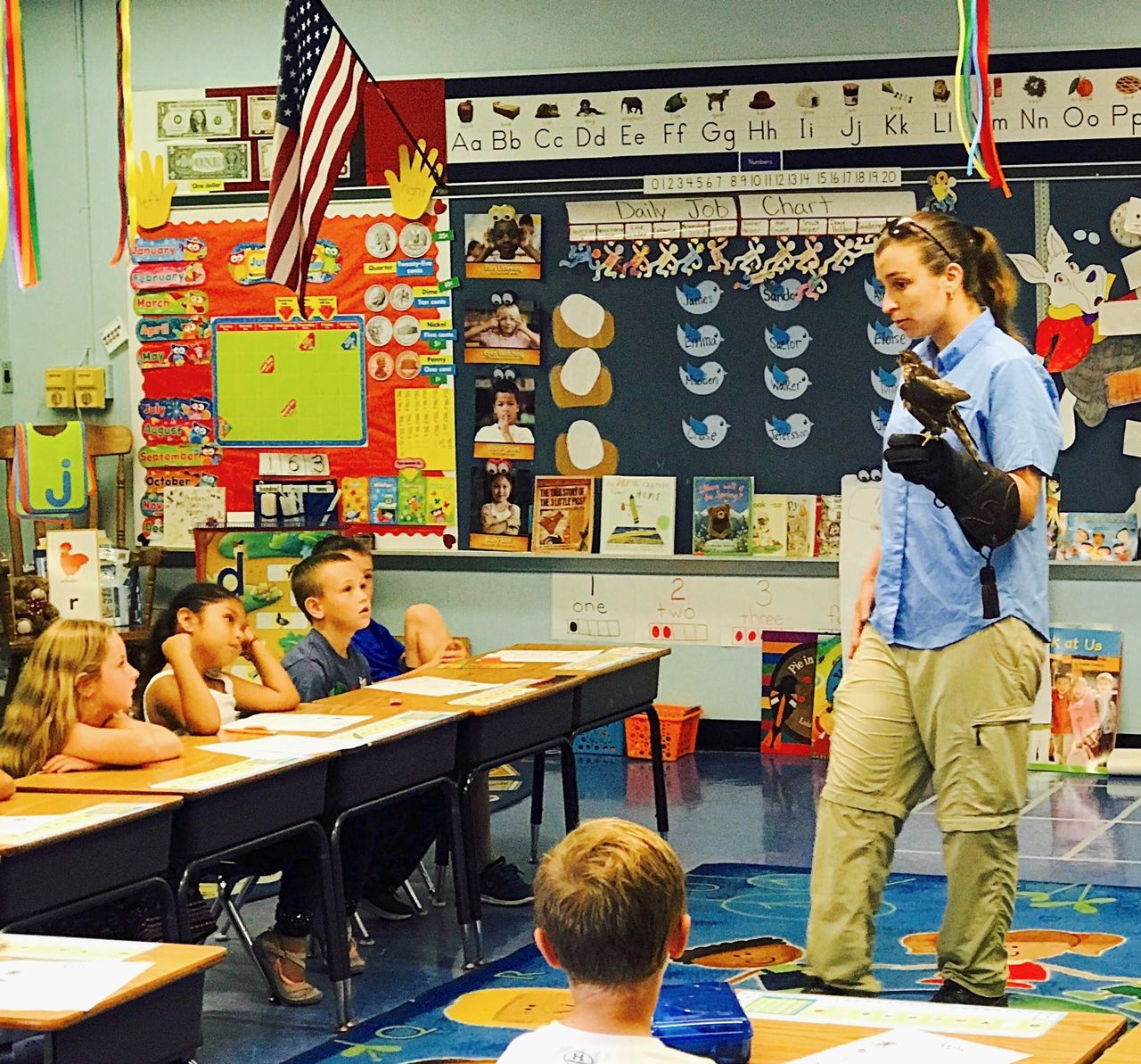 Budnik shares information with a classroom about rehabilitating wild birds.