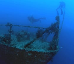 Divers swim on the shipwreck  Spiegel Grove which sunk on its side in 2002 and then was righted by Hurricane Dennis in 2005. Photo by Fraser Nivens/Florida Keys News Bureau